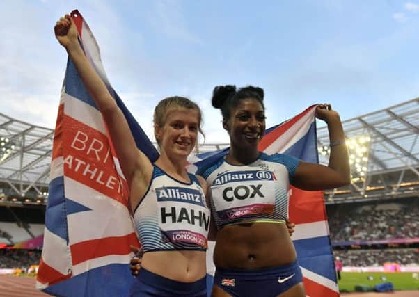 Flying the flag: Great Britain's Kadeena Cox, right, and Sophie Hahn celebrate taking silver and gold, respectively.