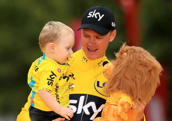 Chris Froome celebrates with his son Kellan after winning the Tour de France (Picture: Adam Davy/PA Wire).