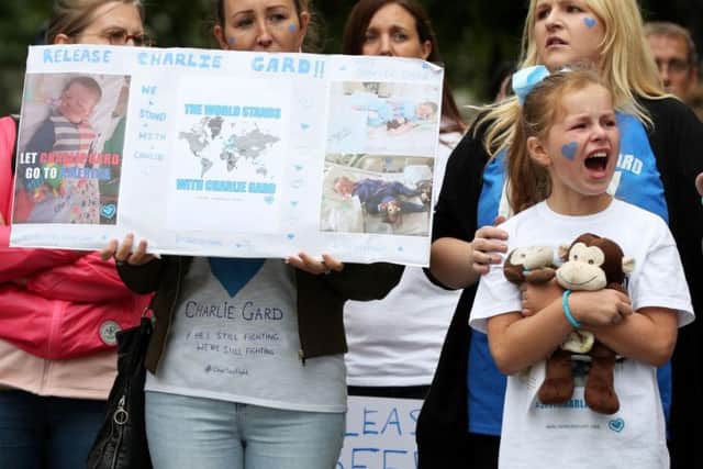 Protesters outside the court supporting Charlie Gard's family