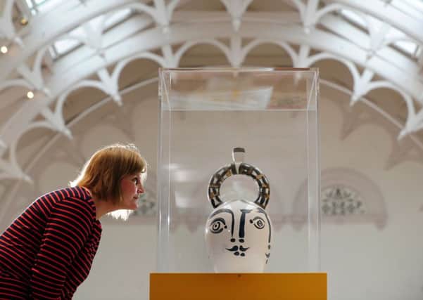 Curator of ceramics Helen Walsh looks at Pablo Picasso's Heads of Women. Picture by Simon Hulme.