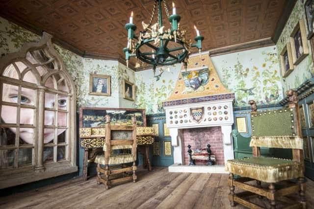 Eight-year-old Freya Gibson looks at a dolls house created by miniaturist Jane Fiddick, at Newby Hall, Yorkshire. PRESS ASSOCIATION Photo. Picture date: Monday July 24, 2017. The dolls house, which took 22 years to create, is the latest addition to one of the most important private collections of dolls houses in the world. The collection at Newby Hall in Yorkshire features nearly 70 dolls houses of all shapes, sizes, styles and ages. See PA story ARTS DollsHouse. Photo credit should read: Danny Lawson/PA Wire