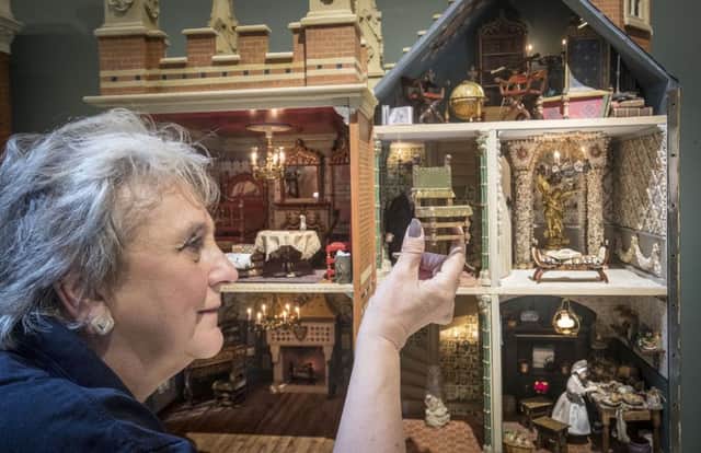 Newby Hall employee Trish Sidebottom holds a chair from a dolls house created by miniaturist Jane Fiddick, at Newby Hall, Yorkshire. PRESS ASSOCIATION Photo. Picture date: Monday July 24, 2017. The dolls house, which took 22 years to create, is the latest addition to one of the most important private collections of dolls houses in the world. The collection at Newby Hall in Yorkshire features nearly 70 dolls houses of all shapes, sizes, styles and ages. See PA story ARTS DollsHouse. Photo credit should read: Danny Lawson/PA Wire