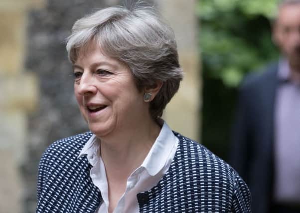 Prime Minister Theresa May is in a substantially weakened position following the election. (PA).