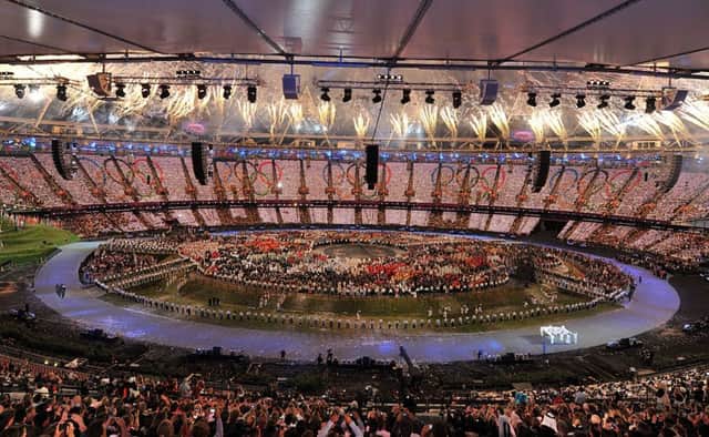 The Olympic Flag is carried in during the London Olympic Games 2012 Opening Ceremony at the Olympic Stadium, London.