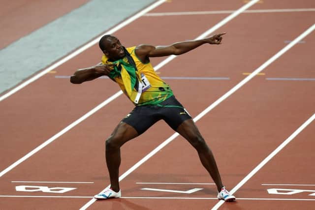 Jamacia's Usain Bolt celebrates winning the men's 200m Final at the Olympic Stadium, London.