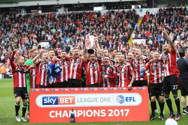 Sheffield United's players celebrate being crowned League One champions at Bramall Lane. Picture: Tim Goode/PA