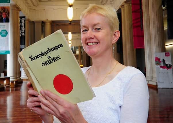 Anne Buckley with the book of memoirs by German PoWs in Skipton. Picture: Simon Hulme