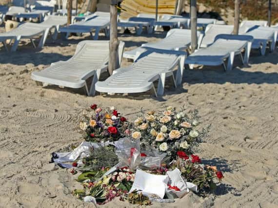 Flowers on the beach near the RIU Imperial Marhaba hotel in Sousse, Tunisia, where 38 people lost their lives after a gunman stormed the beach.  PA