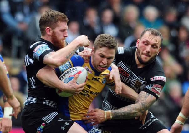Hull FC's Marc Sneyd and Josh Griffin
 smother Leeds Rhinos' Matt Parcell earlier this season. The two teams meet in the Challenge Cup semi-final on Saturday at Doncaster.Picture Tony Johnson.