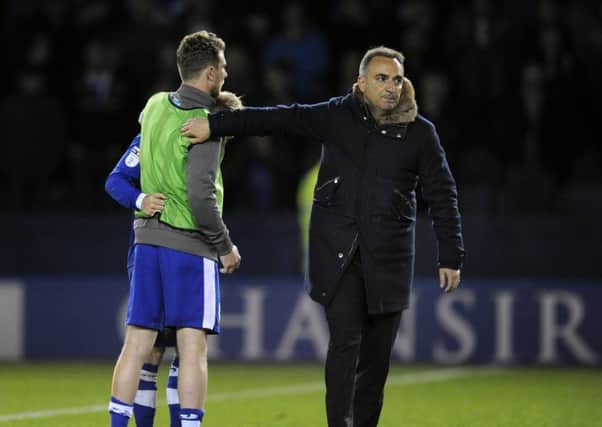 Sheffield Wednesday boss Carlos Carvalhal consoles his players after last season';s Championship play-off semi-final defeat. Picture: Steve Ellis.