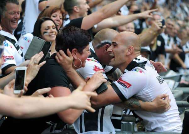 Danny Houghton celebrates with Hull FC fans after the club's Challenge Cup final win last year (Picture: Jonathan Gawthorpe).