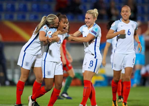 England's Nikita Parris (centre) celebrates scoring her side's second goal of the game. Picture: Mike Egerton/PA