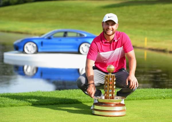 Jordan Smith of England poses with the trophy after winning the Porsche European Open (Picture: Tony Marshall/Getty Images).