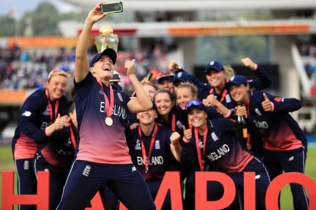 Yorkshire's Katherine Brunt takes a selfie with the England team as they celebrate their World Cup final victory.