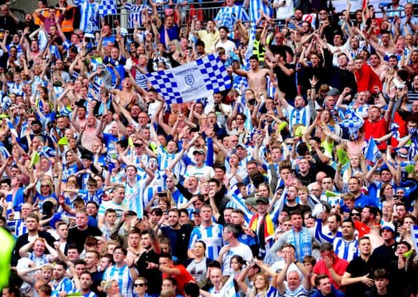 Huddersfield Town fans celebrate promotion to the Premier League via the Championship play-off final at Wembley back in May. Picture: Simon Hulme