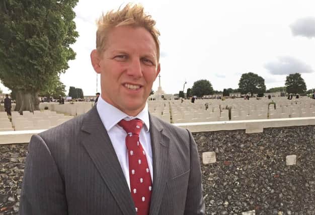 Lewis Moody, who lost his relative Ernest Lovejoy at Passchendaele, at Tyne Cot Cemetery