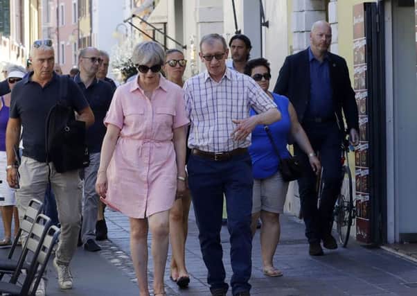 Prime Minister Theresa May and her husband Philip visit Desenzano del Garda, near Lake Garda in northern Italy, during their summer holiday. (PA).