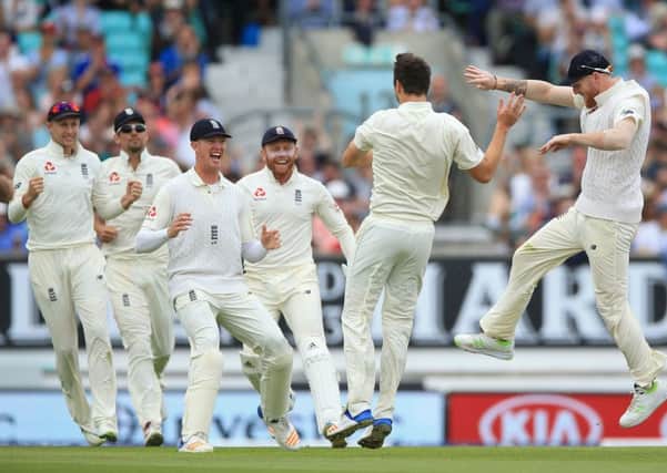 England's Toby Roland-Jones (second right) celebrates after taking the wicket of South Africa's Vernon Philander at The Oval. Picture: Nigel French/PA