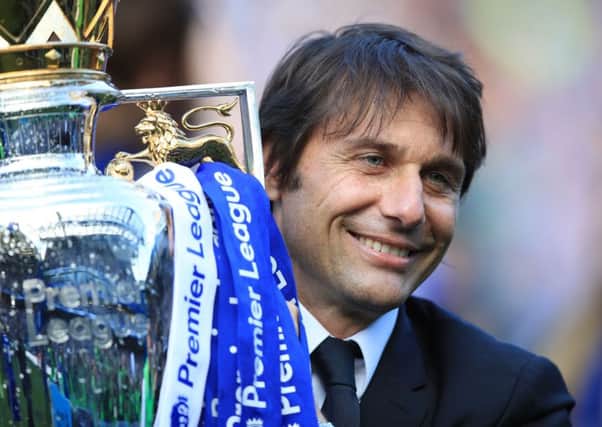 Chelsea manager Antonio Conte with the Premier League title. A strong end of the season for London clubs dented William Hill's profits. Photo: Mike Egerton/PA Wire.