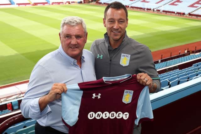 New Aston Villa signing John Terry with manager Steve Bruce during the press conference at Villa Park, Birmingham.