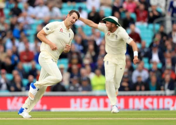 England's Toby Roland-Jones celebrates after bowling out South Africa's Hashim Amla during day two of the 3rd Investec Test match at the Kia Oval, London. (Picture: Adam Davy/PA Wire)
