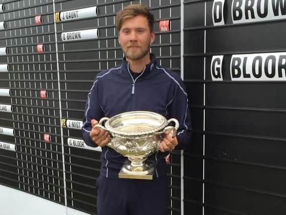 Masham's Dan Brown with the English men's amateur trophy after last year's final at Ganton (Picture: Chris Stratford).