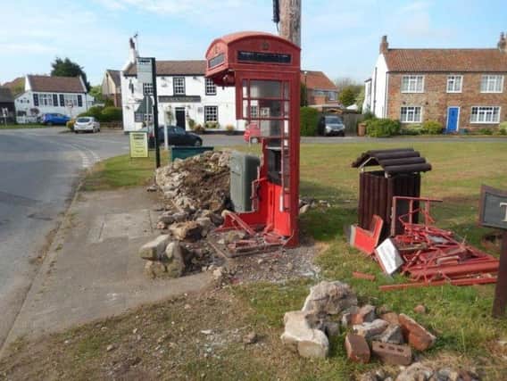 The phone box after it was wrecked by a car