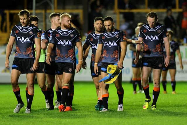 BEATEN: Castleford's players trudge off after losing to St Helens. 
Picture: Jonathan Gawthorpe