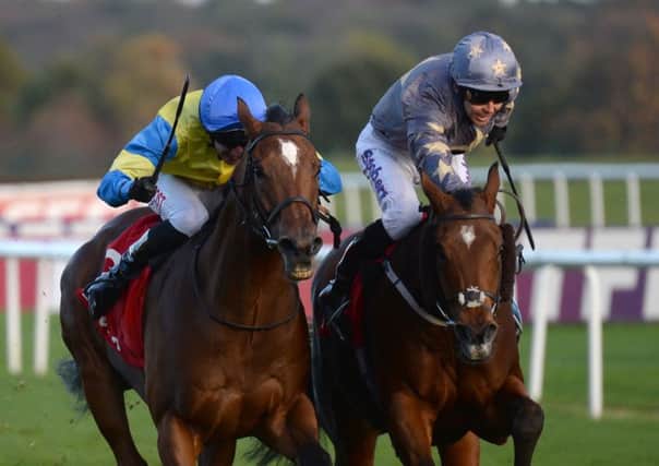Growl, right, winning at Doncaster last November. (Picture: Anna Gowthorpe/PA).
