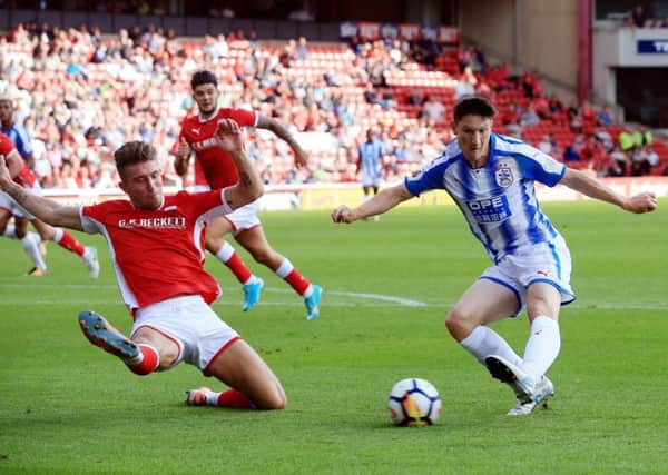 Huddersfield Town's Joe Lolley: In action against one of the clubs interested in him, Barnsley.