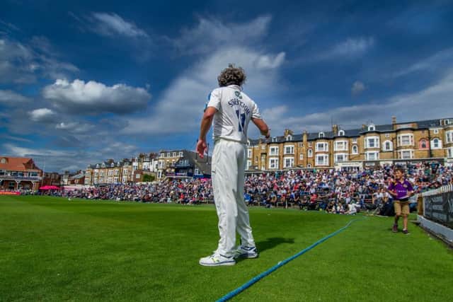Ryan Sidebottom, of Yorkshire, turns to sign an autograph for a young cricket fan, during the Specsavers County Championship Division One match between Yorkshire v Essex at Scarborough Cricket Club (Picture: James Hardisty)