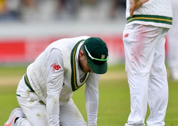 BROUGHT TO HIS KNEES: South Africas Faf du Plessis kneels on the ground after missing an attempted catch at Old Trafford yesterday. His side trail 2-1 in the four-match Test series and are facing a third defeat to England and their new captain Joe Root. (Picture: Anthony Devlin/PA)