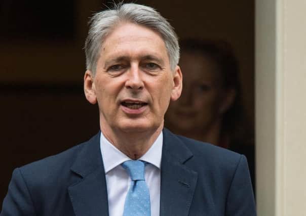 Is Chancellor Philip Hammond diluting plans for Britains exit from the EU?