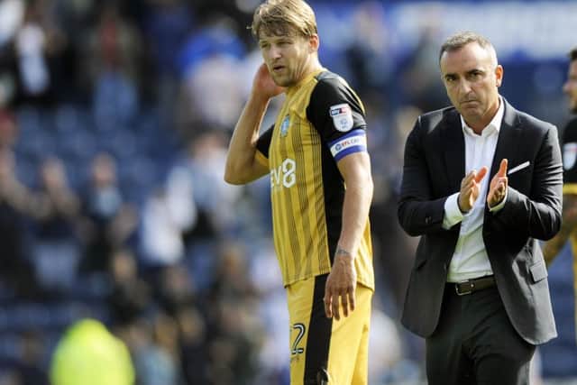 Dejected Sheffield Wednesday coach Carlos Carvalhal alongside his captain Glenn Loovens at the final whistle at Preston (Picture: Steve Ellis).