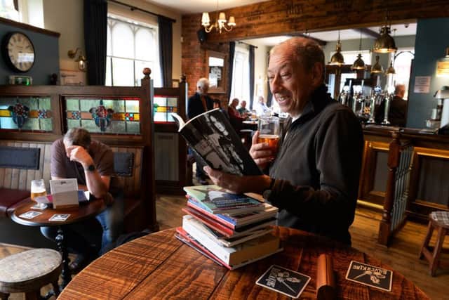 Julian Jordon reading a poetry book at the Riverhead Tap, one of the poerty pubs in Marsden.  Picture: Bruce Rollinson