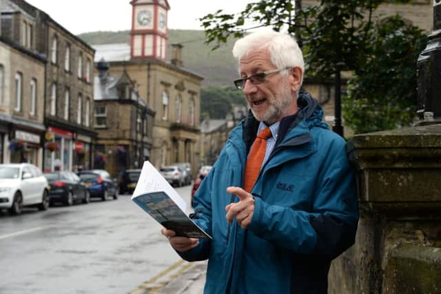 Prof Alan Prout reading a poetry book in Marsden. Picture: Bruce Rollinson