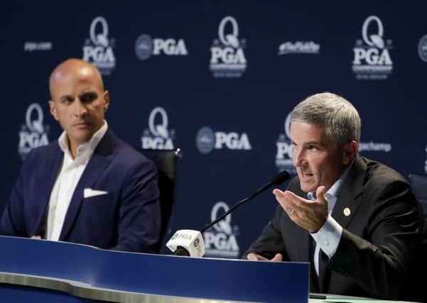 PGA Tour commissioner Jay Monahan speaks as Peter Bevacqua, CEO of the PGA of America, listens during a news conference at the PGA Championship at Quail Hollow, North Carolina (Picture: Chris Carlson/AP).
