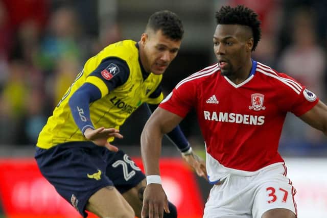 On transfer radar: Oxford United's Marvin Johnson, left, challenging Middlesbrough's Adama Traore.