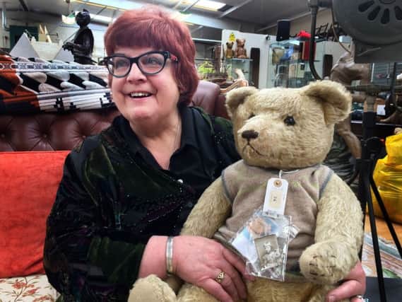 Jill Barker with one of her 35 bears, which she has collected over nearly half a century and are going under the hammer.
