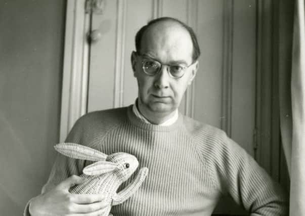 AT HOME: Philip Larkin with a wicker rabbit.
