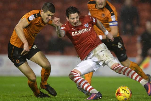 Back to Blades?: Wolves' Conor Coady, challenging Barnsley's Adam Hammill, is wanted by sheffield United.
Picture: Bruce Rollinson