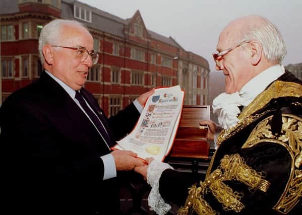Kevin McNamara (left) is made a Freeman of Hull, by the Lord Mayor, Coun. Jim Mulgrove.