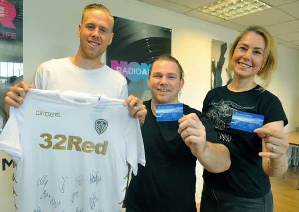 Pontus Jannson with the season tickets he bought for a Radio Aire competition pictured with winners Alex and Jay  Carter.......