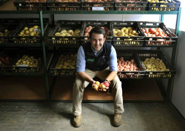 James Hopwood, head of agriculture at Whole Crop Marketing at Kirkburn near Driffield with different varieties of potatoes.