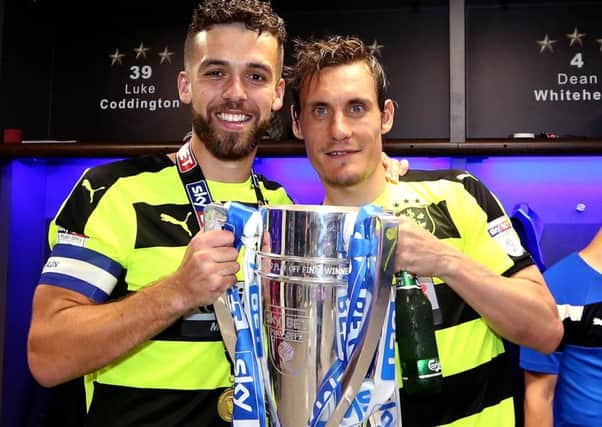 New captain Tommy Smith is pictured with Dean Whitehead as  Huddersfield Town celebrated winning promotion.