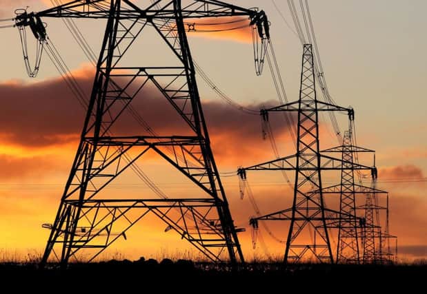 Library image of electricity pylons at sunset Photo:  Andrew Milligan/PA Wire