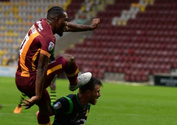 Dominic Poleon strikes the ball past Andy Butler to equalise for Bradford City in their midweek defeat to Doncaster Rovers (Picture: Bruce Rollinson).