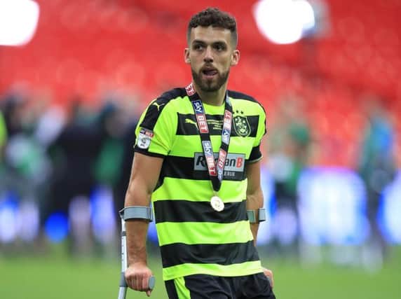 Huddersfield Town's new captain Tommy Smith was injured in the Championship play-off final