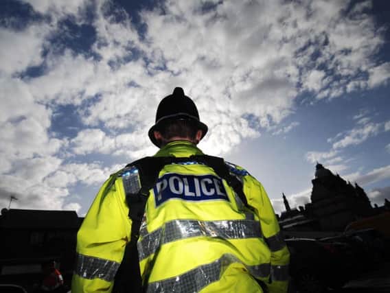 Police are appealing for witnesses after a man tried to take a woman's handbag in a Leeds village.