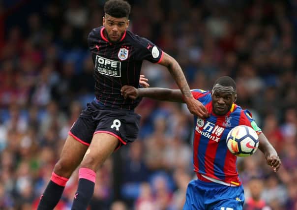 On top of his game: Huddersfield Town's Philip Billing and Crystal Palace's Christian Benteke.